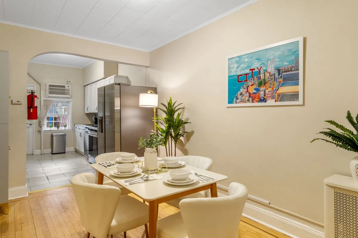 Dining table set for four beside the kitchen